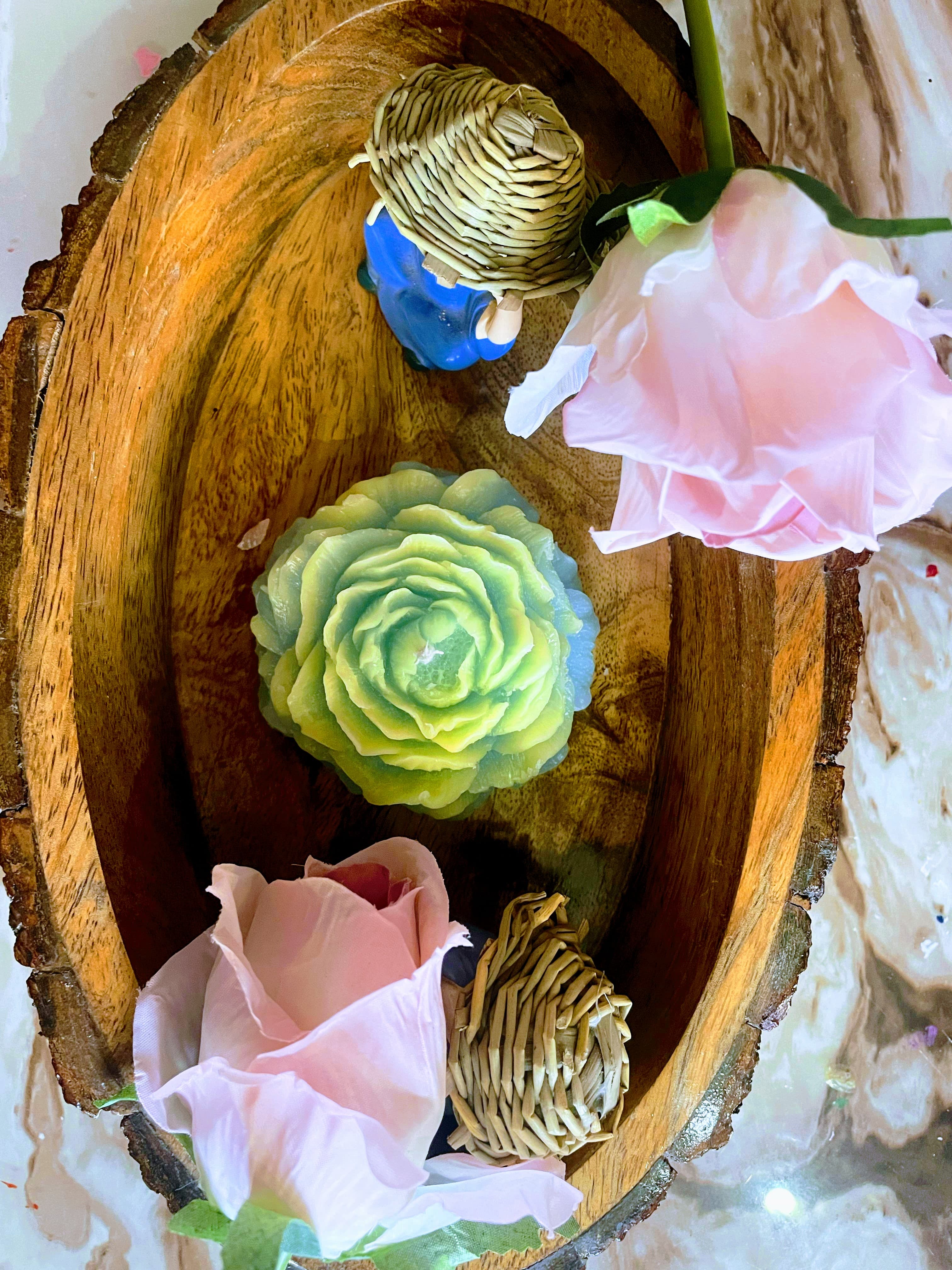 Coconut shell with green candle